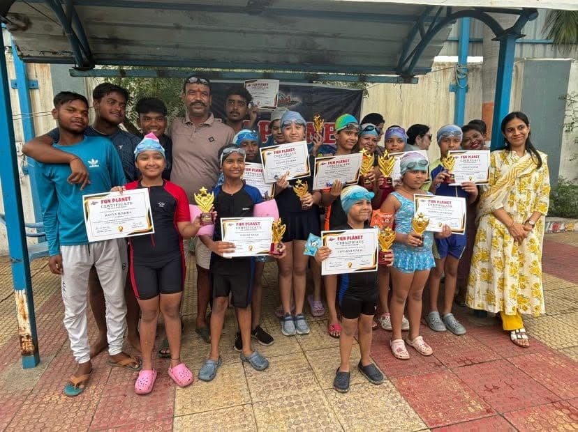 Children with certificates and trophies after Funplanet summer swimming workshop