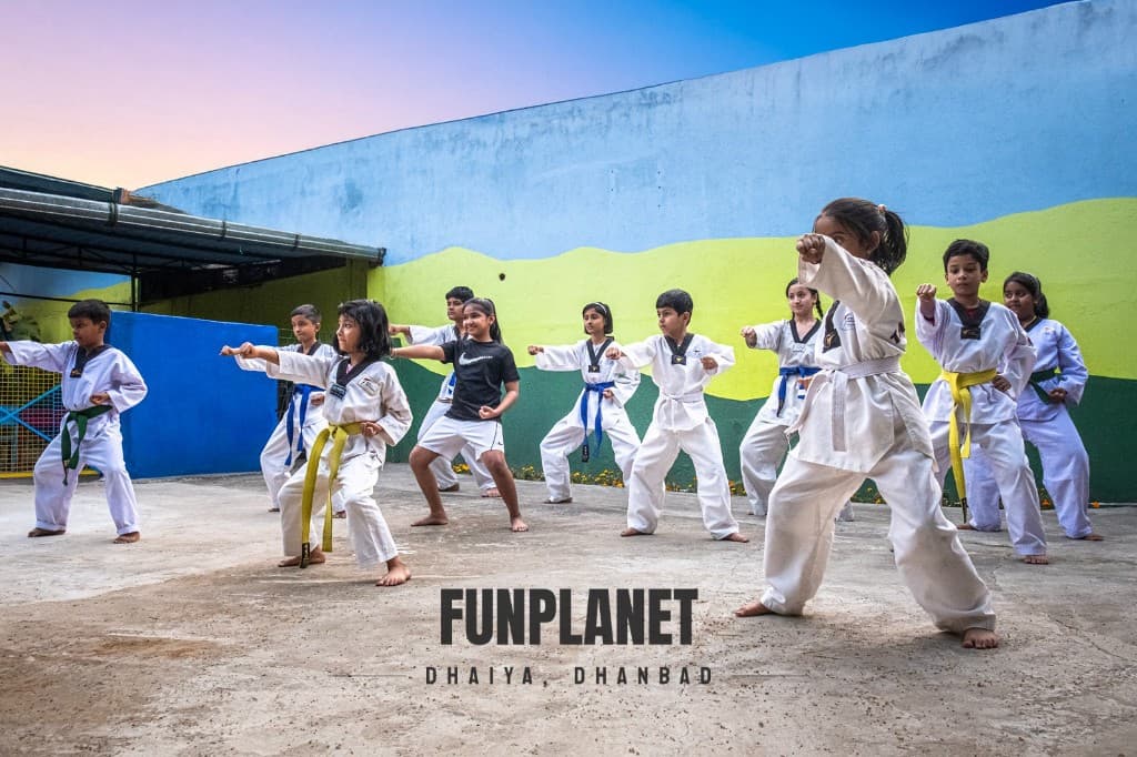 Group of Taekwondo students practicing at sunset at Funplanet Dhanbad